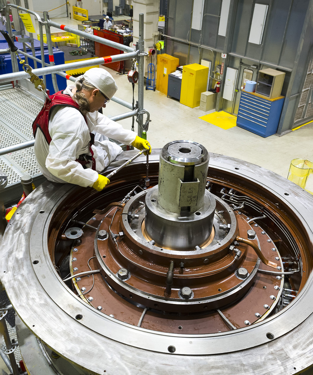 Diverse group of Framatome employees working together in a modern high-tech workspace